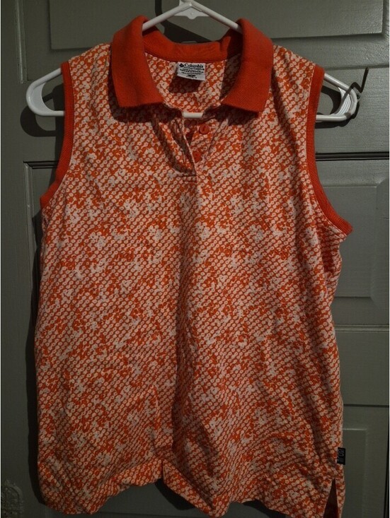 Columbia Tops - Columbia sleeveless polo features a ribbed collar orange buttons. Size M